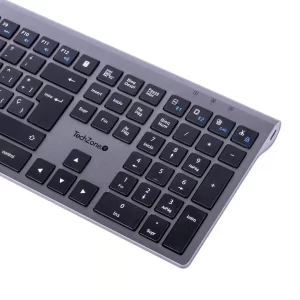 Teclado HEFESTOS recargable con conexión Bluetooth TECHZONE TZACTCB01 color plata, QWERTY. Compatibilidad: Windows, Android y MacOS.