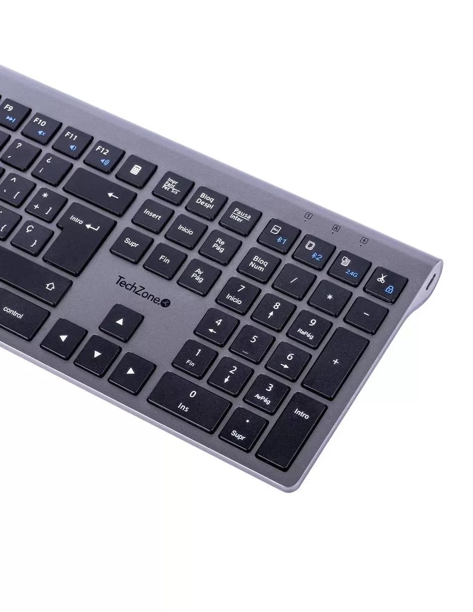 Teclado HEFESTOS recargable con conexión Bluetooth TECHZONE TZACTCB01 color plata, QWERTY. Compatibilidad: Windows, Android y MacOS.